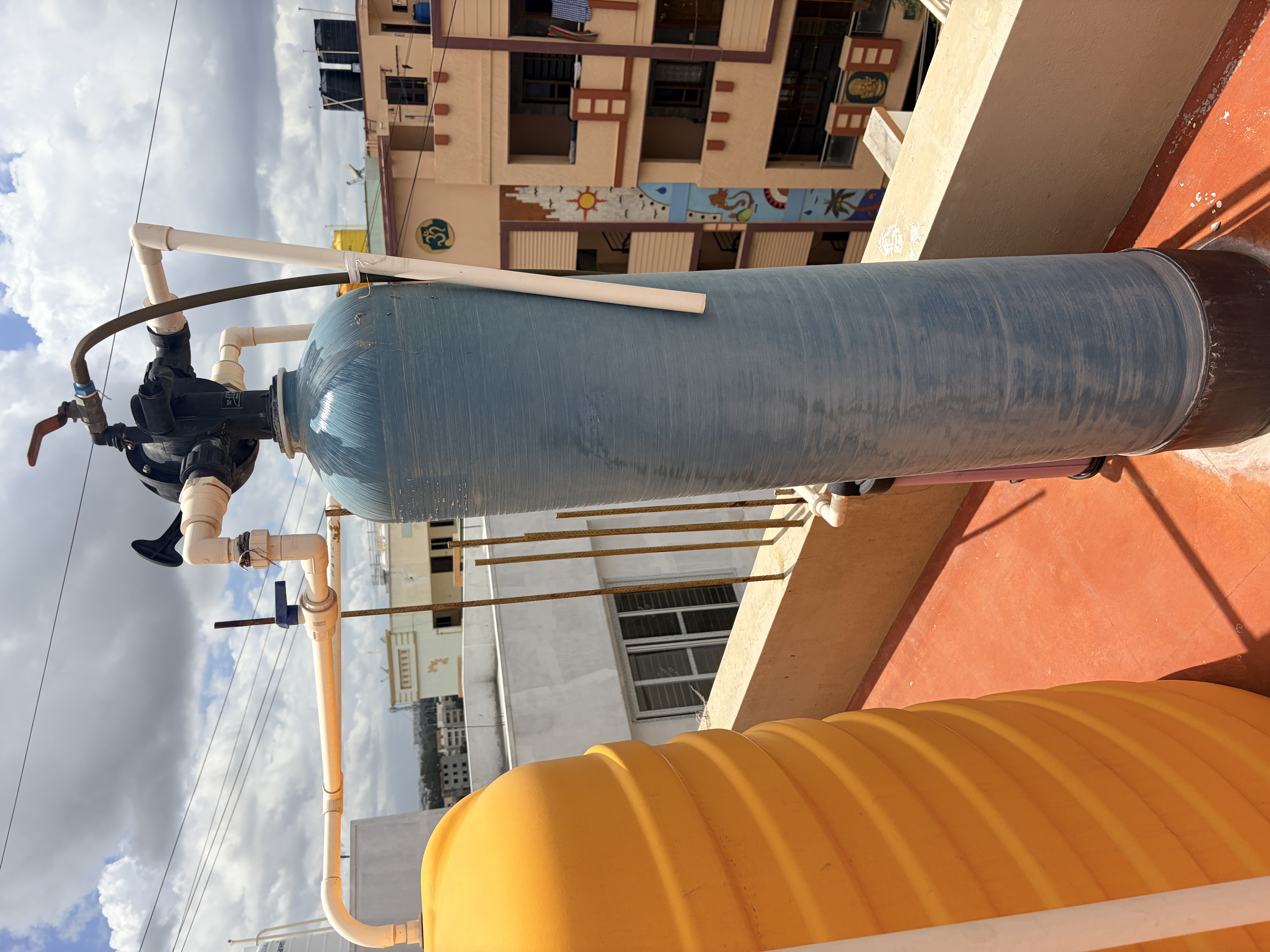 Whole-house water softener installation connected to a building water line